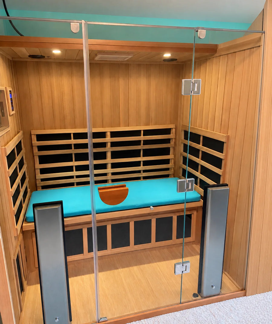 Turquoise cushion inside a glass-front sauna