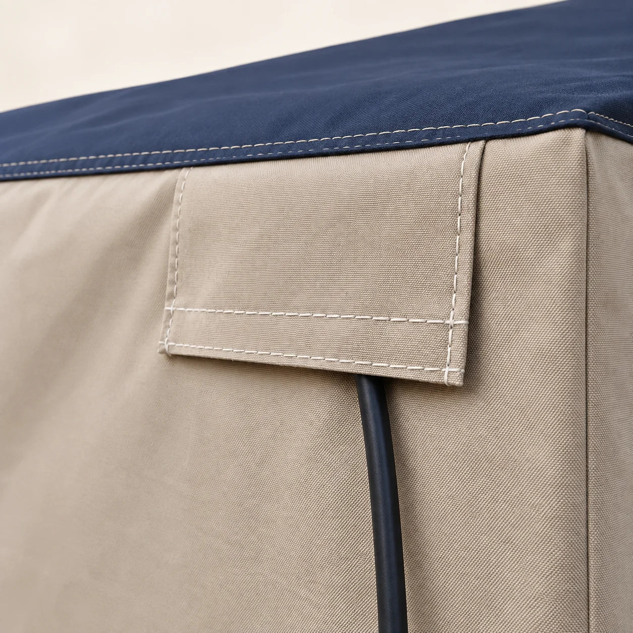 AI illustration: the protective flap over a rear-panel power-cord weather slot.